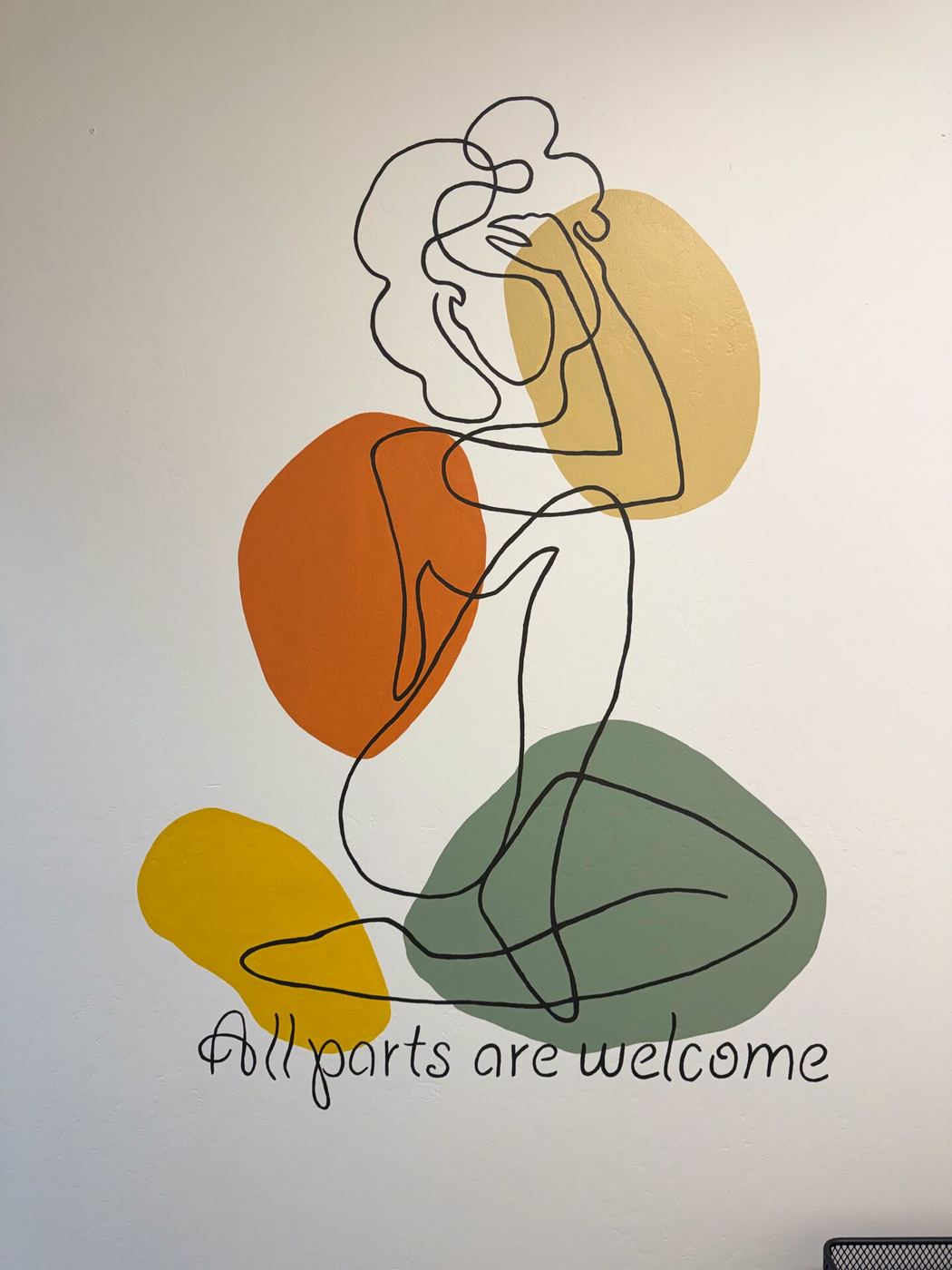 "All parts are welcome" mural inside the ARI Physical Therapy clinic